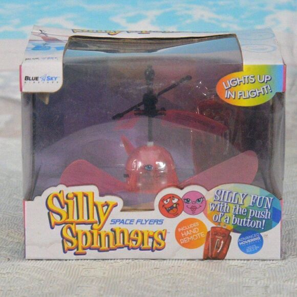 2/$12 Silly Spinners Space Flyers with Hand Remote Lights Up in Flight New - Picture 1 of 4